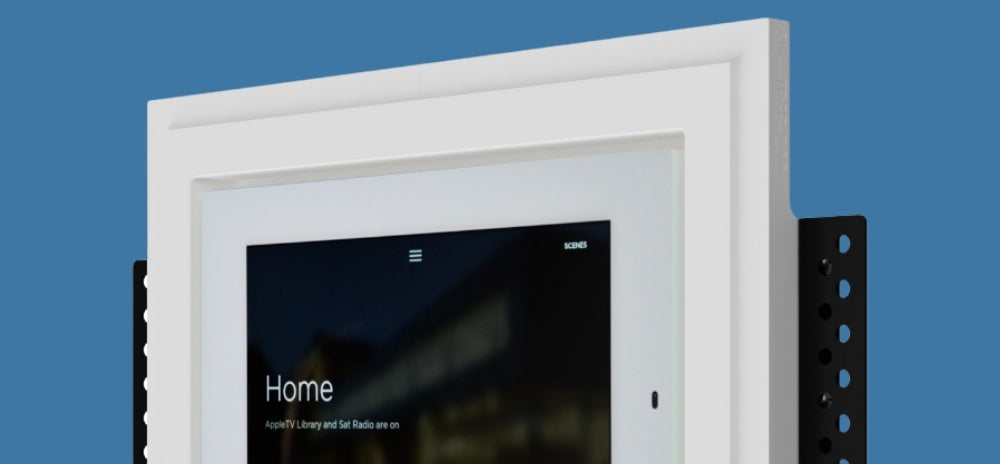 Savant touch panel recessed into a SeeLess white flush in-wall mount (model SLA-TPS8-200), featuring a black display screen and precision side brackets against a blue background.