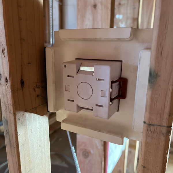 Rear view of a 1-gang dry lining box installed within a SeeLess flush in-wall mounting platform for a Lutron Alisse keypad, showing secure back-box support for a clean, recessed lighting control installation.