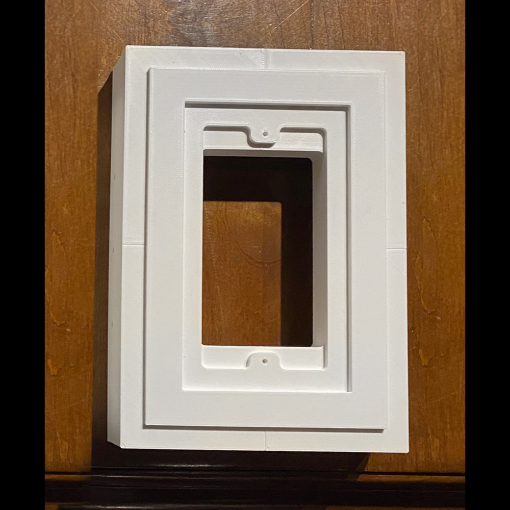 Prototype Close-up of magnetic architectural-style in-wall platform with paintable surface and precision-fit edges for French brass keypad