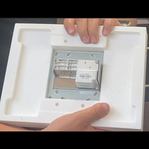 Flush wall installation of Crestron 10″ panel using SLA‑TPCT10‑375 — minimalist modern smart home built‑in mount.