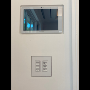 Installed SLA‑TPCT10‑375 flush mount showcasing a Crestron 10″ touch panel — seamless drywall integration.