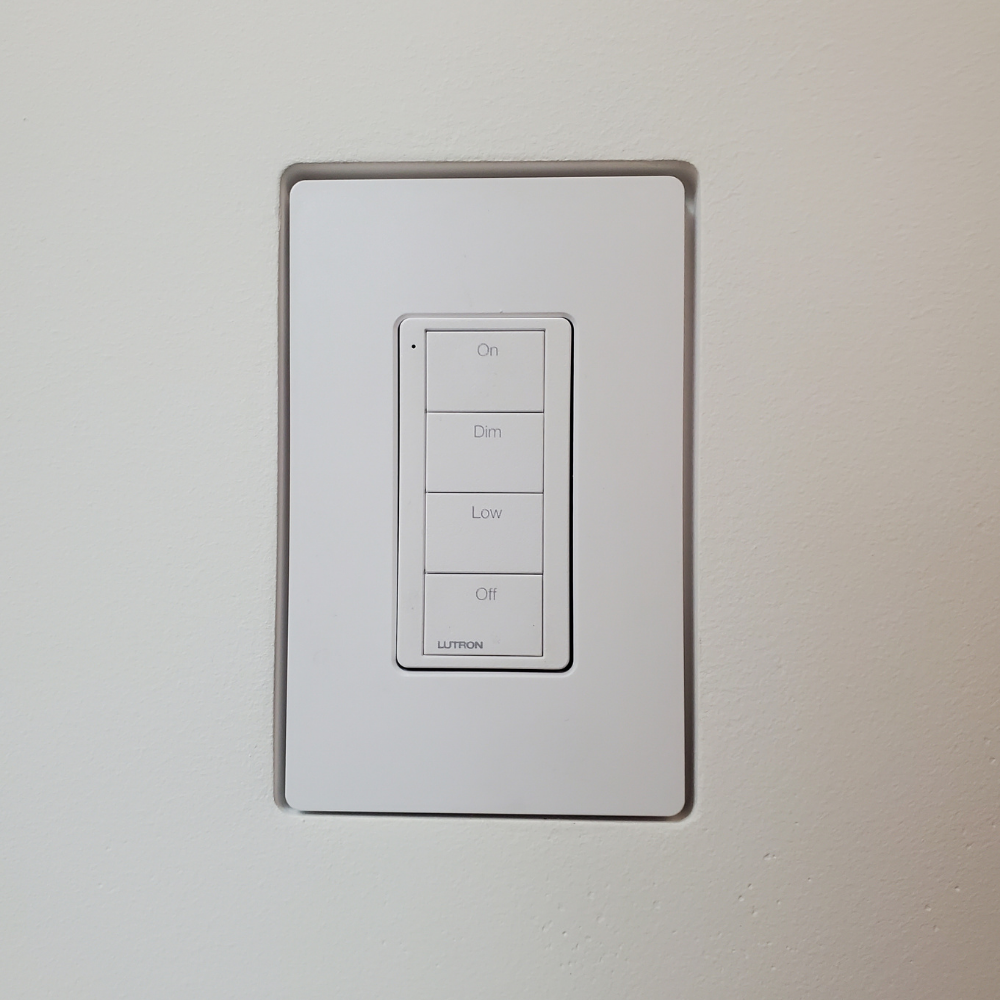 Front View of Mud-In Mount with Lutron Faceplate. Designer style with One Fourth inch reveal.