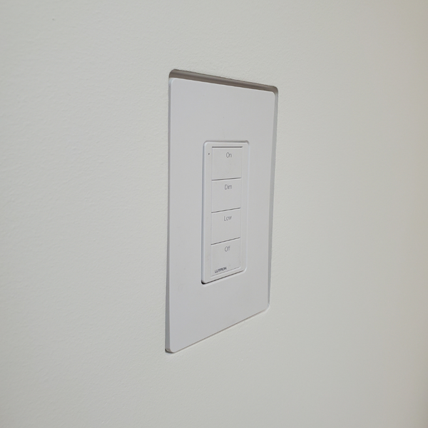 Right side of Mud-In Mount with Lutron Faceplate. Designer style with One Fourth inch reveal.