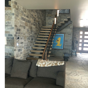 Modern smart home wall with ELAN 8″ touch panel integrated via SeeLess SLS‑TPS8E‑062 platform.