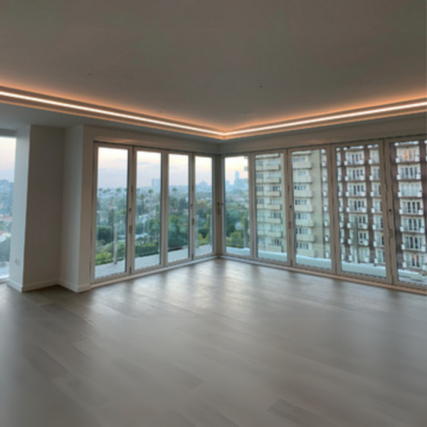 Installed SLS-GLCC15 Gypsum Lighting Crown Cove creating ambient indirect lighting in a living room