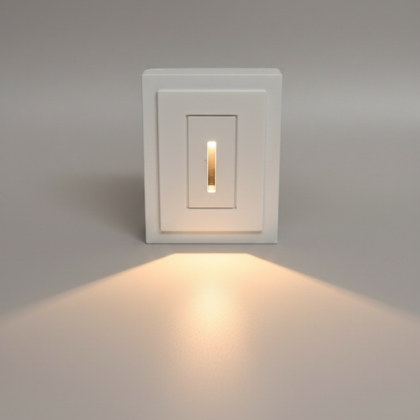 SeeLess miniature step light: SL-3005-062 rectangular profile with 1/16" reveal  with glowing warm light