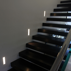 Modern staircase with flush in-wall steps lights