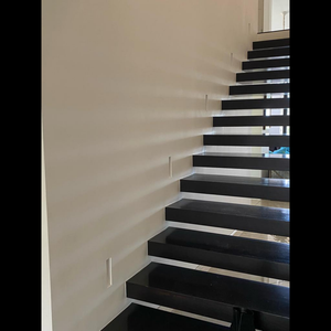 SeeLess step light platform with painted finish blending into wall for minimalist look