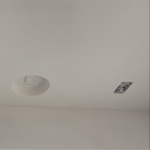 Seamless gypsum platform for flush mounting 5.5" x 2.5" smoke and sensor devices. Installed on ceiling.