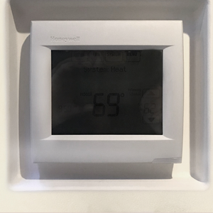 Universal square thermostat flush in-wall mounting platform by SeeLess — front angled view.